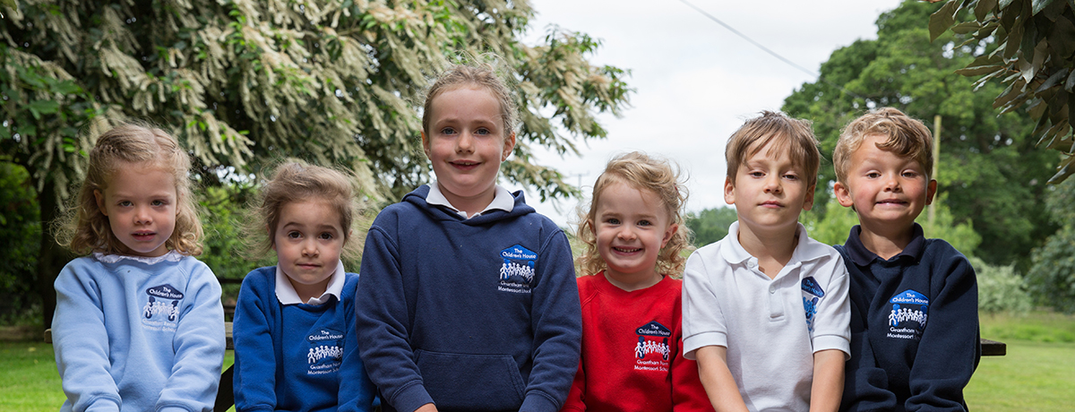 Children in uniform: sky blue, royal blue, the hoodie, red, white, navy blue (Grantham Farm Montessori School)