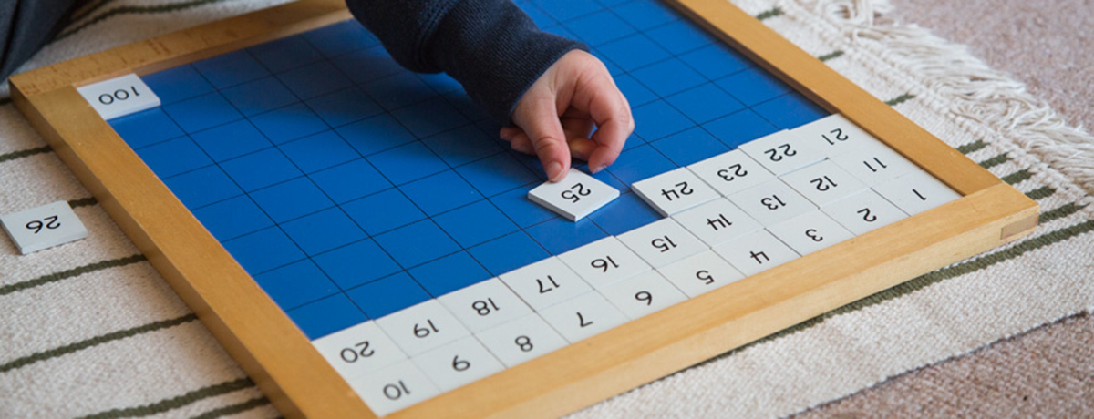 Child placing numbers (Grantham Farm Montessori School)