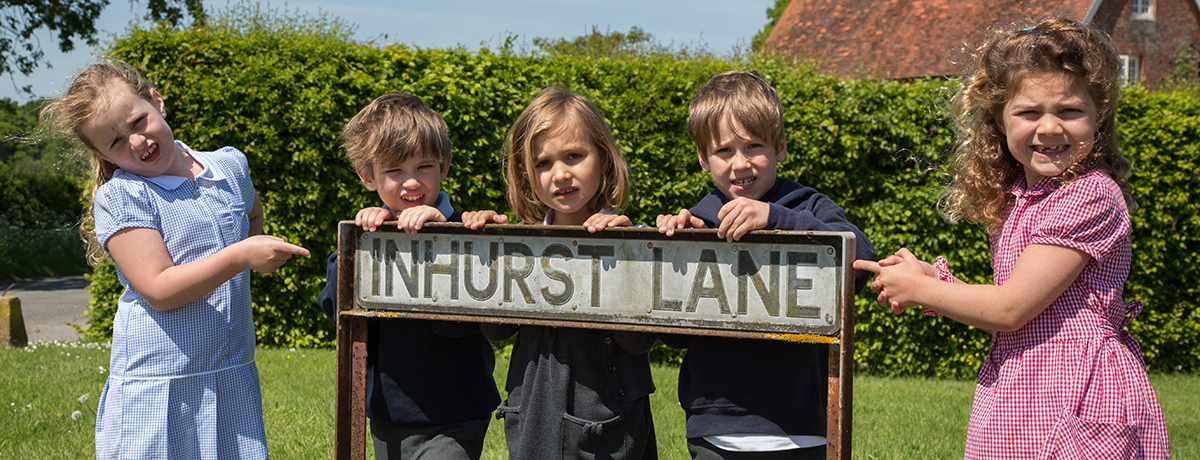 Children and Inhurst Lane road name sign (Grantham Farm Montessori School and the Children's House)