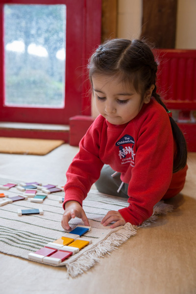 Girl with colour blocks (Grantham Farm Montessori School)