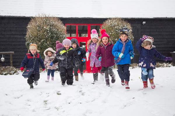 Children running in snow (Grantham Farm Montessori School)